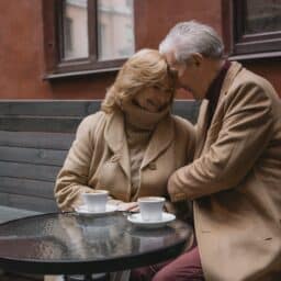 Older couple enjoying a date at an outdoor cafe.